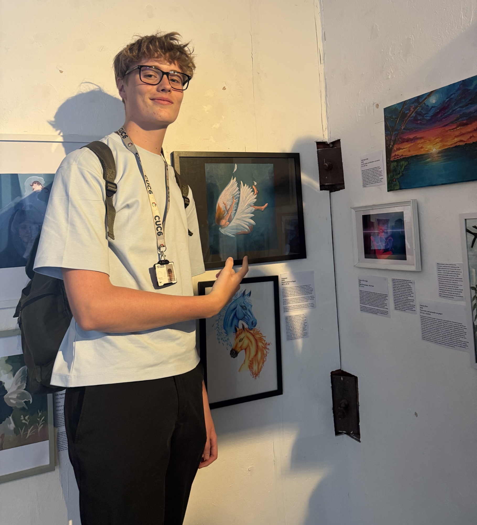 Student in front of the exhibition